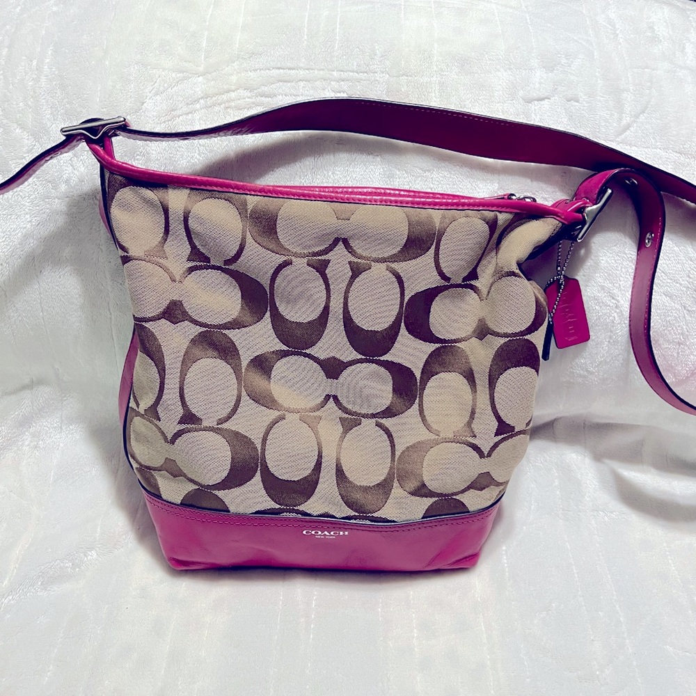 Coach crossbody, tan and hot pink. Used, slightly wear. In good shape!